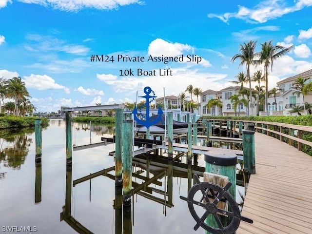 dock area with a water view and boat lift