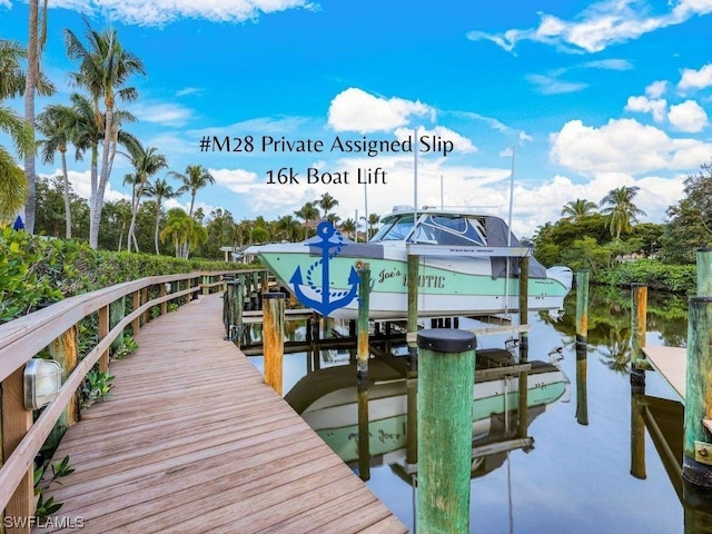 view of dock with a water view and boat lift