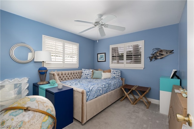 bedroom with light colored carpet and ceiling fan