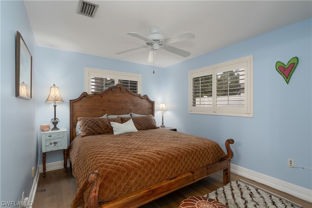 bedroom featuring dark wood-type flooring and ceiling fan