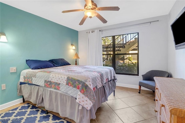 bedroom featuring ceiling fan and light tile patterned flooring