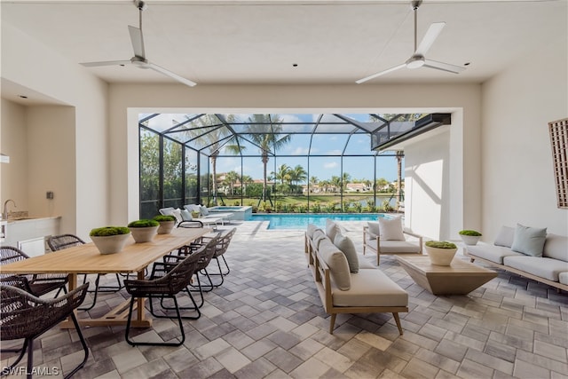 view of patio / terrace with a swimming pool with hot tub, an outdoor hangout area, and glass enclosure