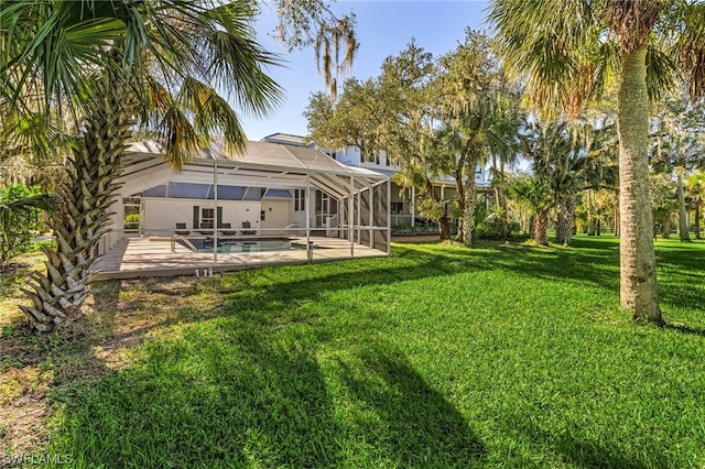 view of yard featuring a patio area and a lanai