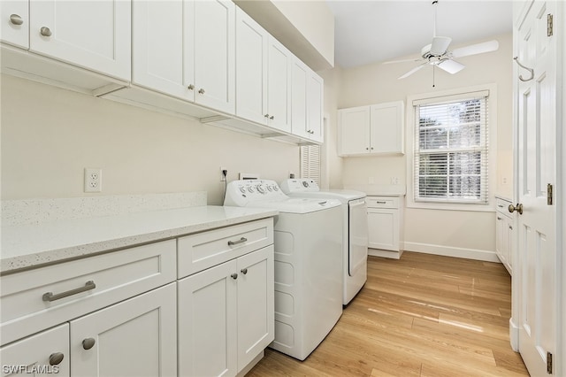 laundry room with hookup for a washing machine, cabinets, ceiling fan, washer and clothes dryer, and light wood-type flooring