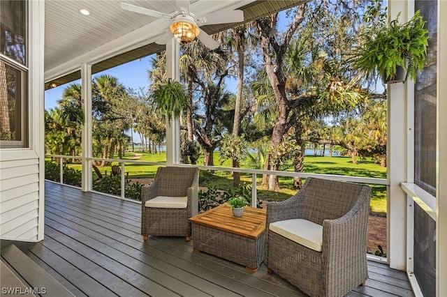 wooden deck featuring a yard