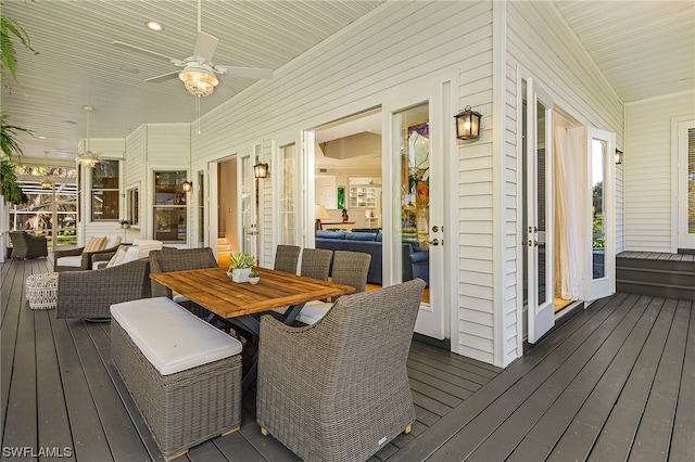 wooden deck with ceiling fan and an outdoor hangout area