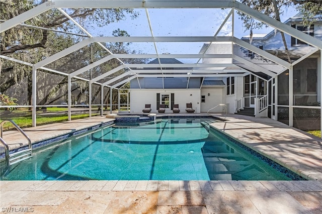 view of pool featuring a patio area and glass enclosure