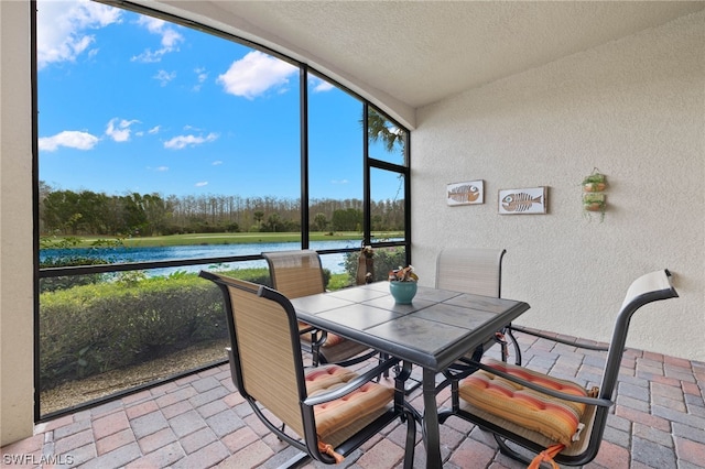 sunroom with a water view