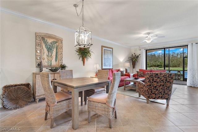 dining space with ornamental molding and light tile patterned floors