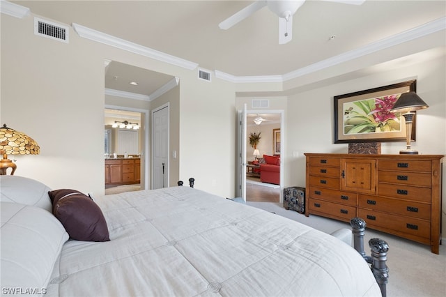 carpeted bedroom featuring ornamental molding, ensuite bathroom, and ceiling fan