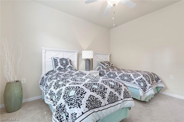 bedroom featuring ceiling fan and light colored carpet