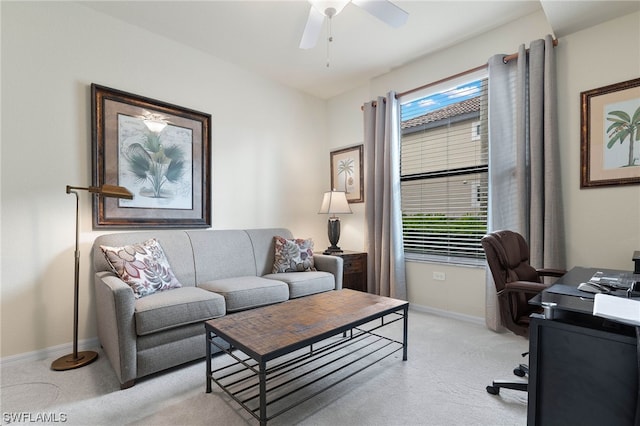 carpeted office with a healthy amount of sunlight and ceiling fan