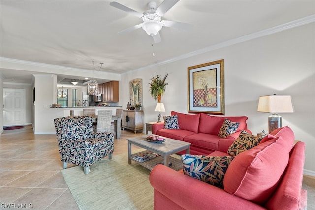 tiled living room with crown molding and ceiling fan