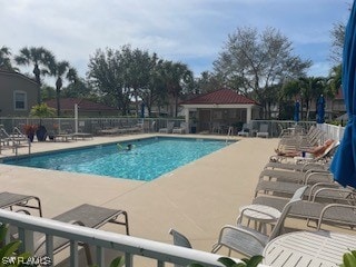 view of swimming pool with a gazebo and a patio