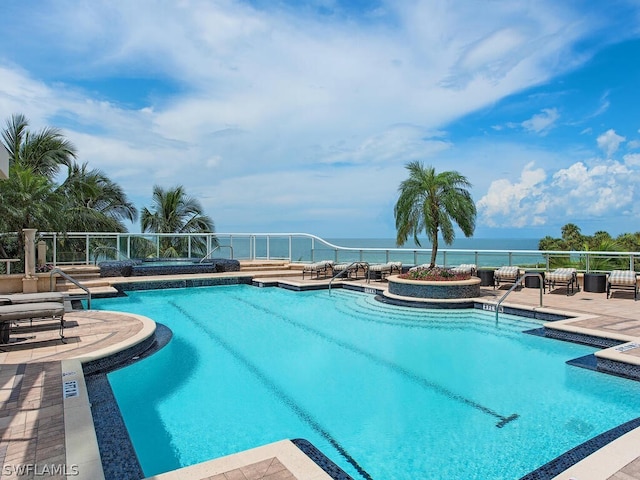 4101 Gulf Shore Blvd N Unit Ph-3, Naples, FL 34103 - community pool featuring a water view and a patio area