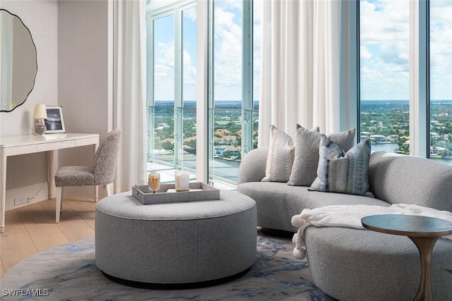 4101 Gulf Shore Blvd N Unit Ph-3, Naples, FL 34103 - living room featuring a wealth of natural light and wood finished floors