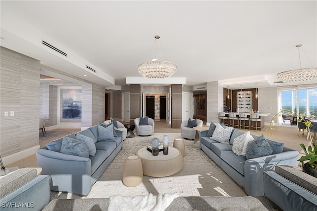 4101 Gulf Shore Blvd N Unit Ph-3, Naples, FL 34103 - living room with baseboards, visible vents, and a chandelier