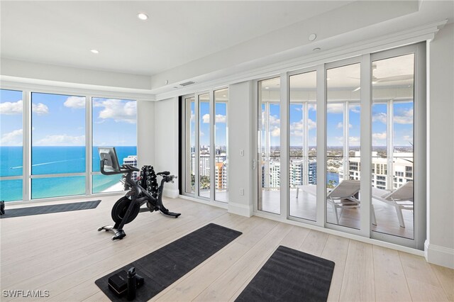 4101 Gulf Shore Blvd N Unit Ph-3, Naples, FL 34103 - workout area with wood finished floors, baseboards, visible vents, a water view, and recessed lighting