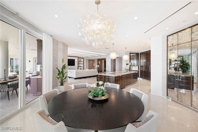 4101 Gulf Shore Blvd N Unit Ph-3, Naples, FL 34103 - dining area featuring a notable chandelier and recessed lighting