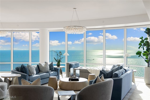 4101 Gulf Shore Blvd N Unit Ph-3, Naples, FL 34103 - sunroom featuring an inviting chandelier and a water view