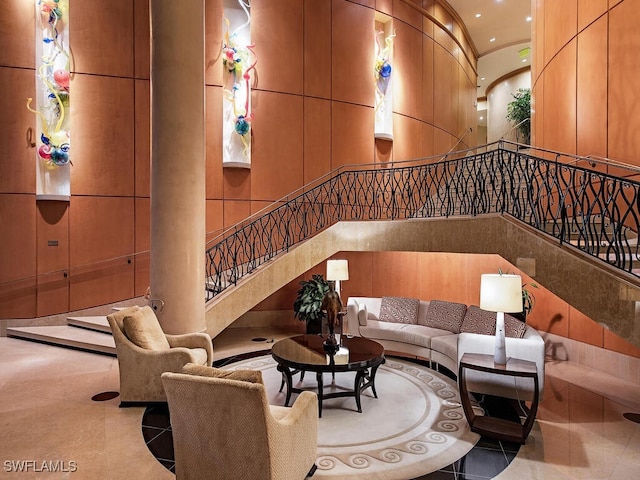 4101 Gulf Shore Blvd N Unit Ph-3, Naples, FL 34103 - living room featuring a towering ceiling, stairs, and recessed lighting