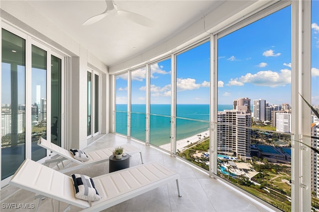 4101 Gulf Shore Blvd N Unit Ph-3, Naples, FL 34103 - sunroom / solarium featuring a ceiling fan, a water view, and a city view
