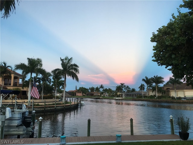 property view of water with a dock