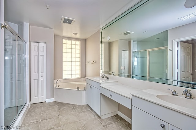 bathroom featuring tile patterned floors, vanity, and independent shower and bath