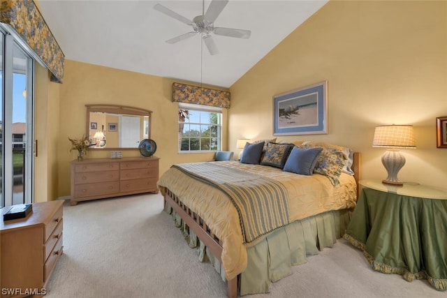 carpeted bedroom featuring ceiling fan and lofted ceiling