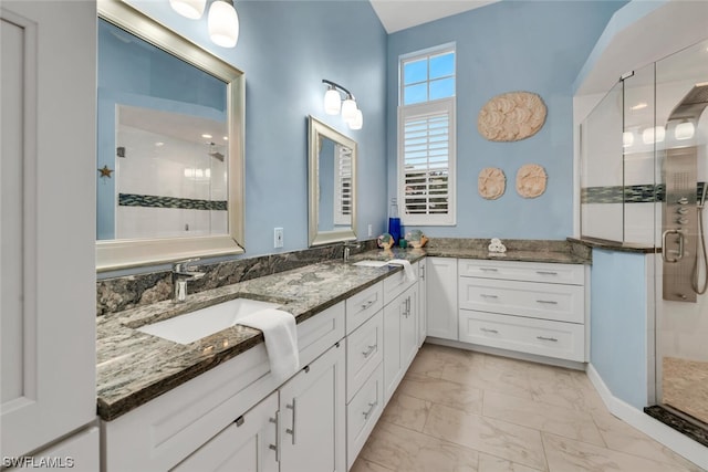 bathroom featuring vanity and walk in shower