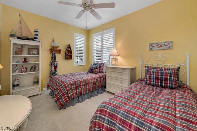 bedroom featuring ceiling fan and light colored carpet