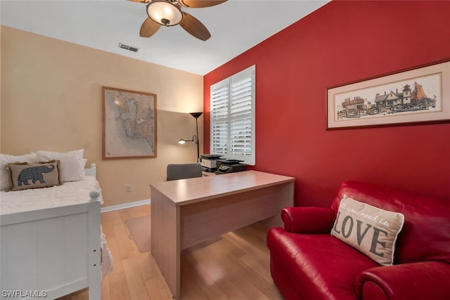 office area with ceiling fan and light hardwood / wood-style flooring