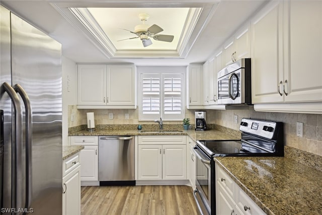 kitchen featuring white cabinets and appliances with stainless steel finishes