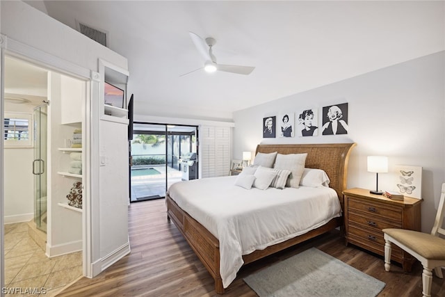 bedroom featuring wood-type flooring, multiple windows, and ceiling fan