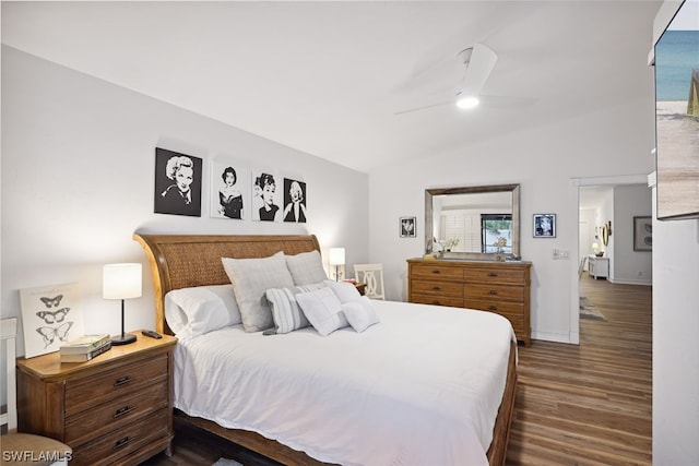 bedroom featuring lofted ceiling, ceiling fan, and dark hardwood / wood-style flooring