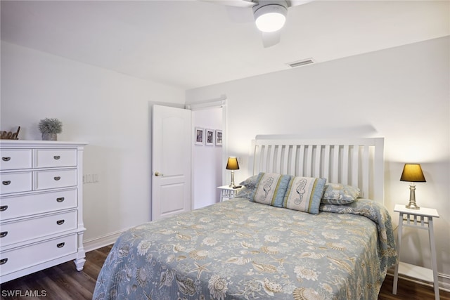 bedroom featuring ceiling fan and dark hardwood / wood-style floors