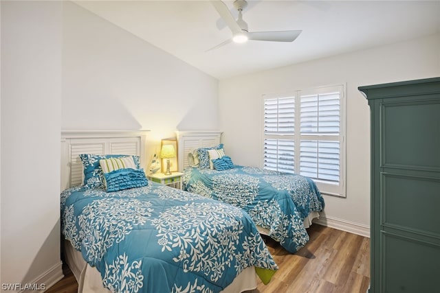 bedroom featuring ceiling fan and hardwood / wood-style flooring