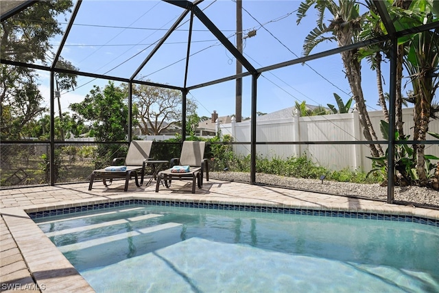view of pool with a lanai and a patio area