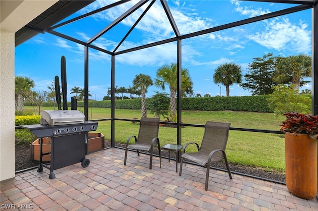 view of patio / terrace featuring a lanai and a grill