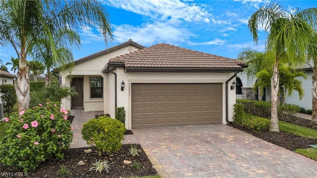 mediterranean / spanish-style house with a garage