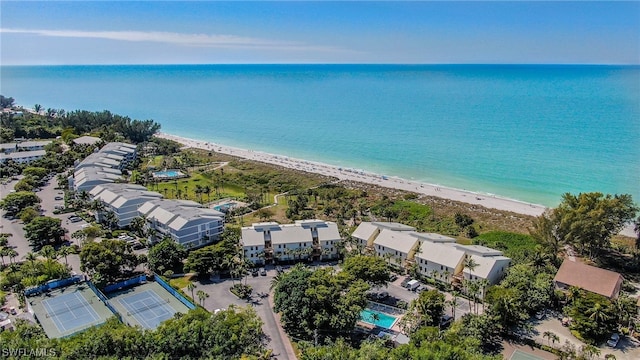 drone / aerial view with a view of the beach and a water view