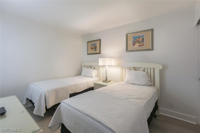 bedroom featuring dark hardwood / wood-style flooring