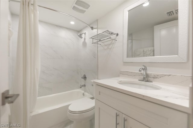 full bathroom with vanity, toilet, and shower / bath combo