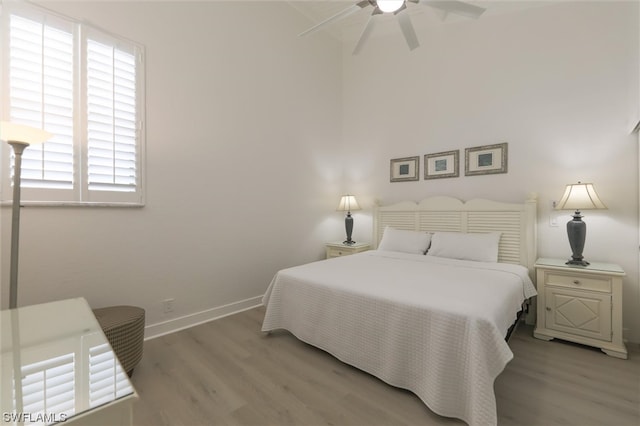 bedroom featuring light hardwood / wood-style flooring and ceiling fan