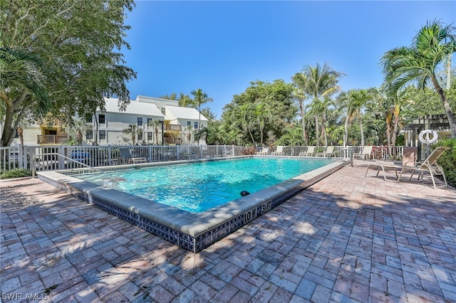 view of swimming pool featuring a patio area