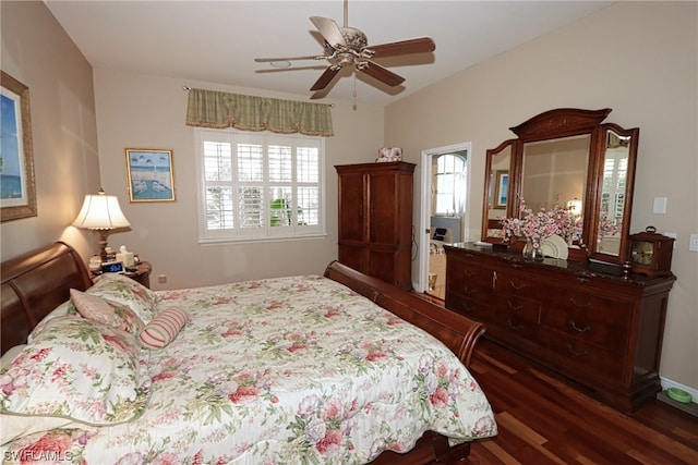 bedroom with dark hardwood / wood-style floors and ceiling fan