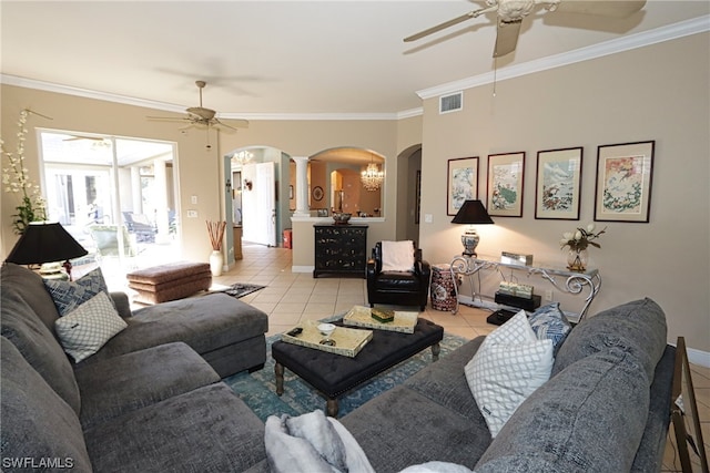 tiled living room with crown molding, decorative columns, and ceiling fan