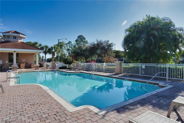 view of swimming pool featuring a patio area