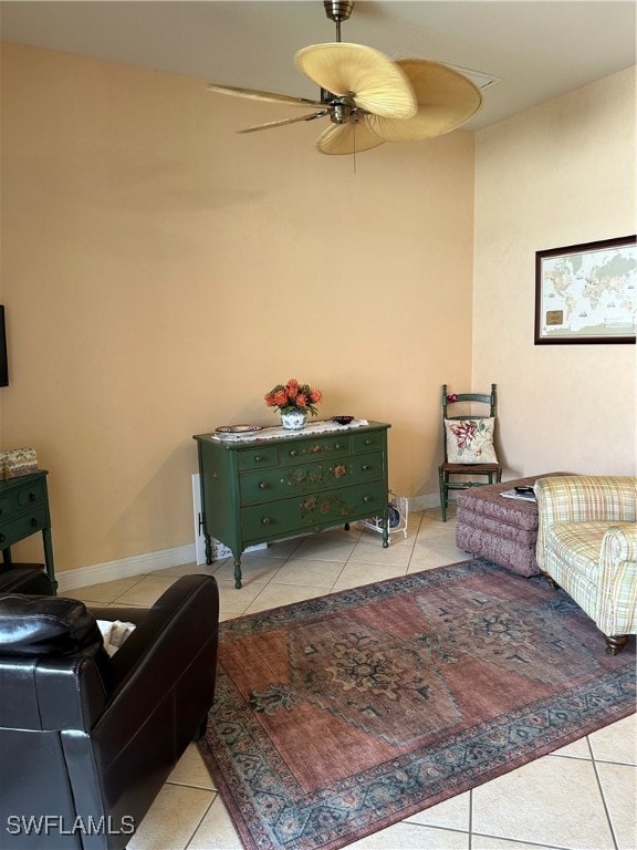 interior space featuring ceiling fan and light tile patterned floors