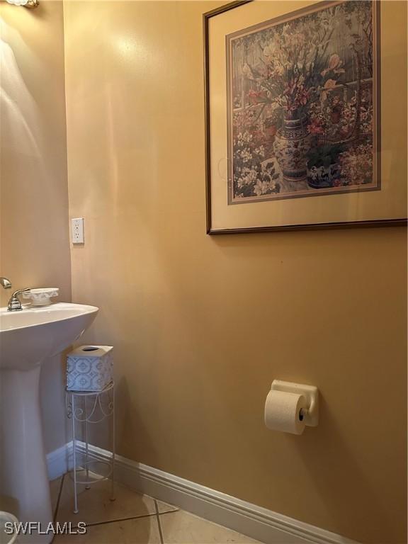 bathroom featuring sink and tile patterned flooring